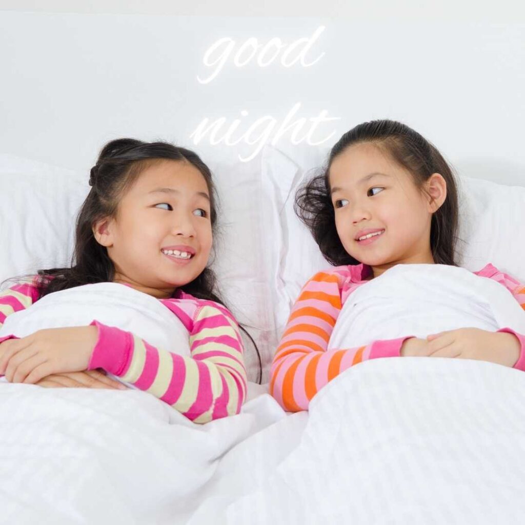 Good-Night-Images Two Cute Girl spending Happy Moment  in Bed Portrait